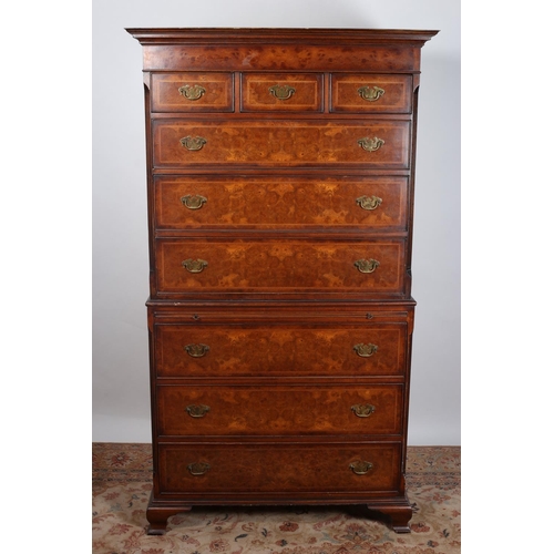 15 - A GEORGIAN DESIGN BURR WALNUT CHEST ON CHEST the moulded cornice above three short and three long dr... 