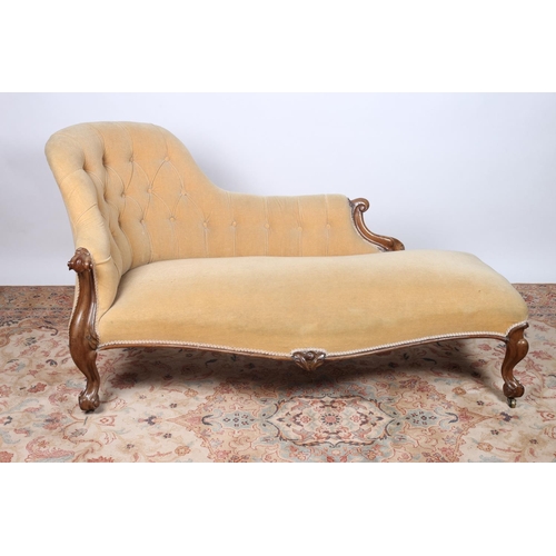 22 - A VICTORIAN MAHOGANY AND UPHOLSTERED CHAISE LONGUE the deep button upholstered shaped back and seat ... 