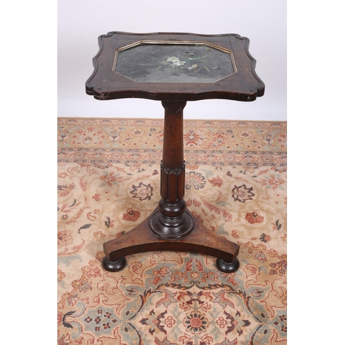 26 - A REGENCY ROSEWOOD OCASSIONAL TABLE of serpentine outline the shaped top with carved scrolls to the ... 
