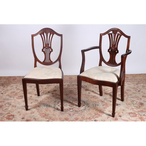 28 - A SEVEN PIECE HEPPLEWHITE DESIGN MAHOGANY DINING SUITE comprising six chairs including a pair of elb... 