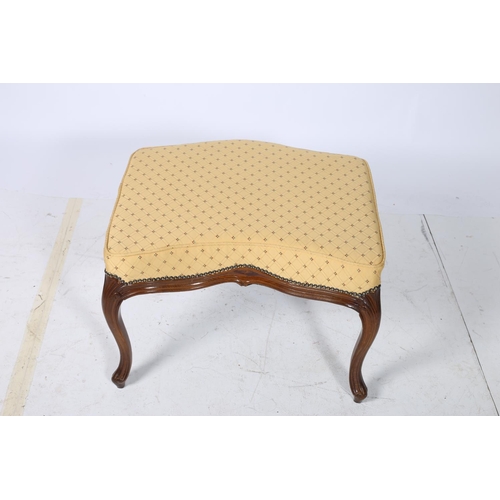 33 - A CONTINENTAL WALNUT AND UPHOLSTERED STOOL the serpentine seat above a moulded apron on cabriole leg... 