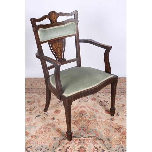 49 - AN EDWARDIAN MAHOGANY AND SATINWOOD INLAID ELBOW CHAIR the shaped top rail above an upholstered pane... 