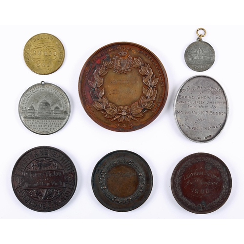 32 - Irish exhibition medals. An 1865 Dublin International Exhibition bronze award medal awarded to E. Wi... 