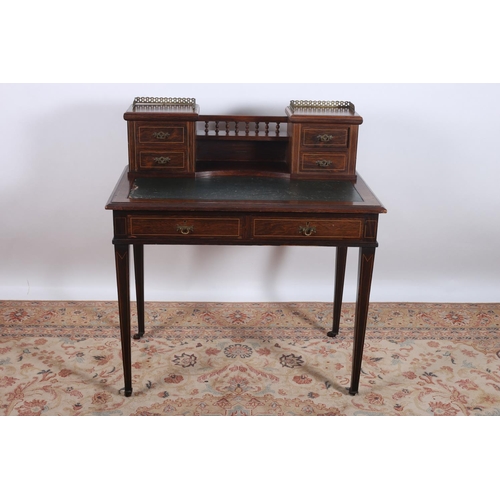 18 - AN EDWARDIAN ROSEWOOD AND SATINWOOD INLAID DESK the superstructure with four short drawers and pierc... 