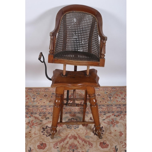 19 - A VINTAGE MAHOGANY AND BERGERE CHILD'S HIGH CHAIR on baluster legs joined by cross stretchers 91cm (... 