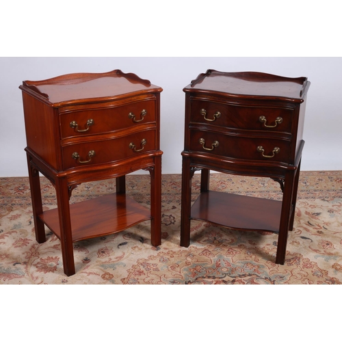 28 - A PAIR OF GEORGIAN DESIGN MAHOGANY CHESTS each of serpentine outline with moulded three quarter gall... 