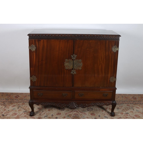 47 - A CHIPPENDALE DESIGN MAHOGANY SIDE CABINET of rectangular outline with gadrooned rim above a pair of... 