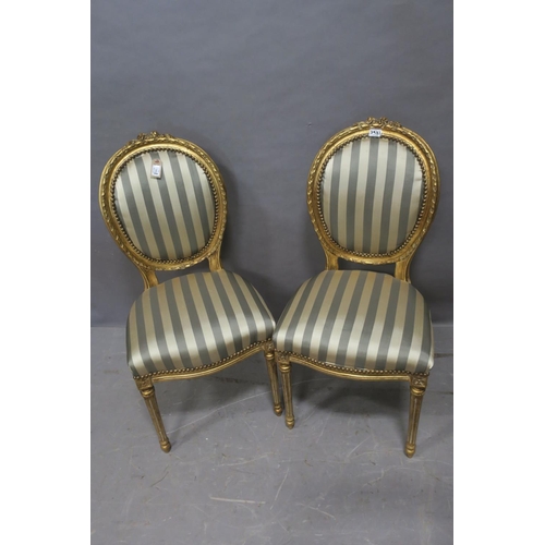 51 - A GOOD PAIR OF FRENCH CARVED GILTWOOD AND UPHOLSTERED SIDE CHAIRS each with a foliate carved crestin... 