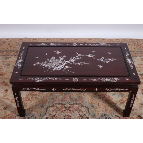 56 - AN ORIENTAL ROSEWOOD AND MOTHER OF PEARL INLAID COFFEE TABLE of rectangular outline with moulded apr... 