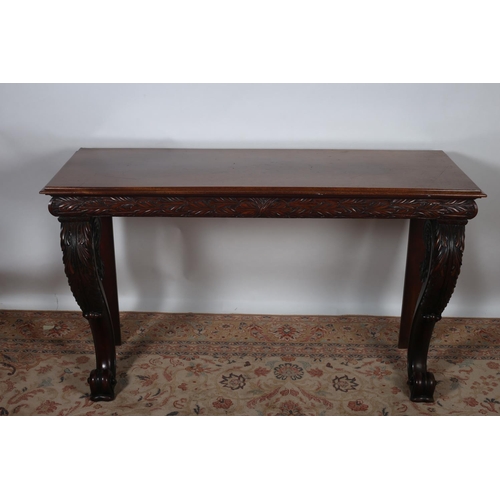 10 - A 19TH CENTURY CARVED MAHOGANY CONSOLE TABLE of rectangular outline with foliate carved frieze on fr... 
