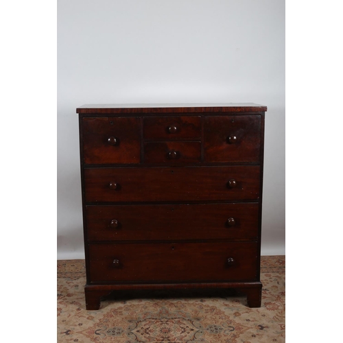 14 - A 19TH CENTURY MAHOGANY CHEST of rectangular outline the shaped top above two deep two short drawers... 