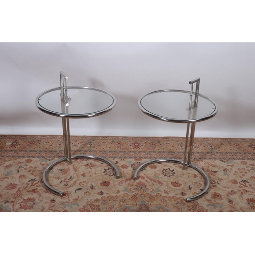 19 - AFTER EILEEN GRAY A PAIR OF CHROME AND GLAZED TABLES each of circular outline raised on a telescopic... 