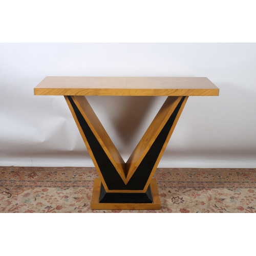 36 - AN ART DECO DESIGN WALNUT AND EBONISED CONSOLE TABLE of rectangular outline the shaped top raised on... 