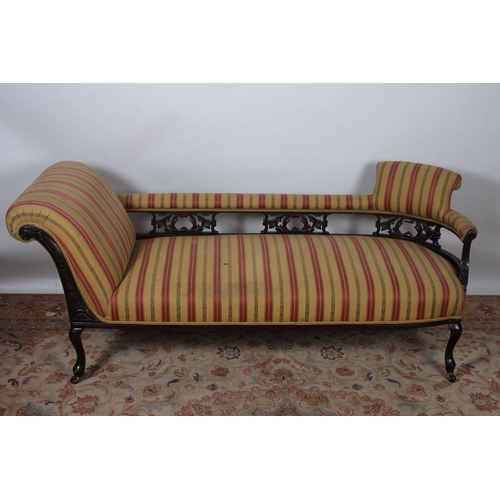 4 - A VINTAGE MAHOGANY AND UPHOLSTERED CHAISE LONGUE the upholstered top rail and seat joined by pierced... 