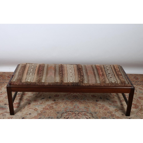 41 - A GEORGIAN DESIGN MAHOGANY STOOL of rectangular outline the removable seat with camel sack upholster... 
