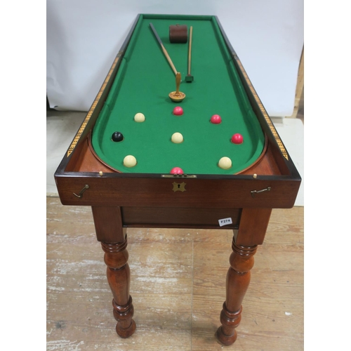 44 - A FINE 19th CENTURY MAHOGANY FOLDING BAGATELLE TABLE, raised on a telescopic stand with baluster leg... 