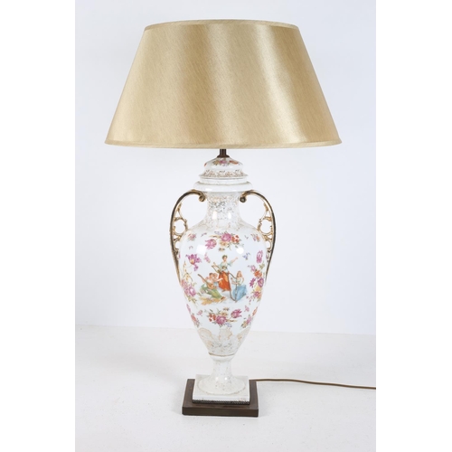48 - A CONTINENTAL PORCELAIN TABLE LAMP of vase form the white and gilt ground with painted panel depicti... 