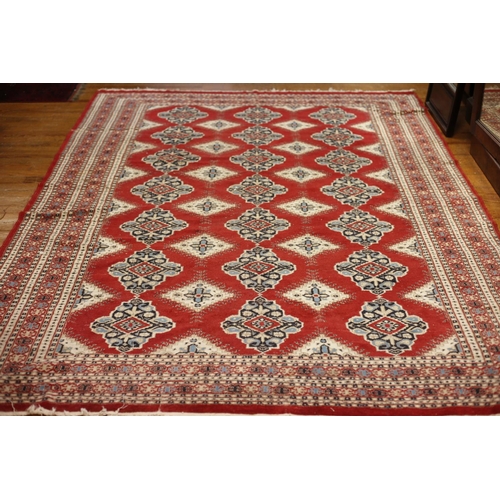53 - A HERATI WOOL RUG the red beige and light blue ground with central panel filled with stylized flower... 