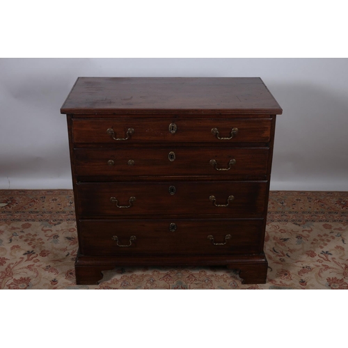 9 - A GEORGIAN MAHOGANY CHEST of rectangular outline the shaped top above four long graduated drawers wi... 