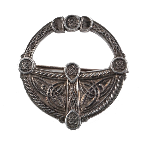 42 - 19th century Celtic-revival brooch, white metal, in the form of a cloak-pin, finely decorated with C... 