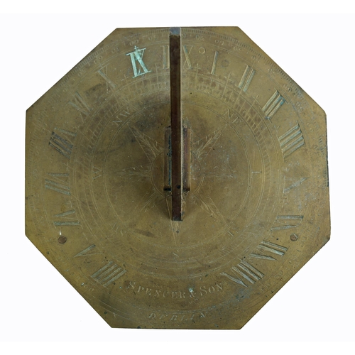 33 - An early 19th century brass octagonal sundial, the gnomon centred on a finely engraved compass rose ... 