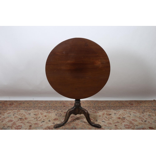 21 - A GEORGIAN MAHOGANY BREAKFAST TABLE the circular hinged top above a baluster column on tripod suppor... 