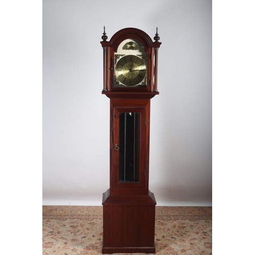 33 - A MAHOGANY LONG CASE CLOCK the rectangular arched hood containing a brass dial with Roman numerals i... 
