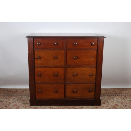 9 - A 19TH CENTURY MAHOGANY CHEST of rectangular outline the shaped top above eight drawers with turned ... 