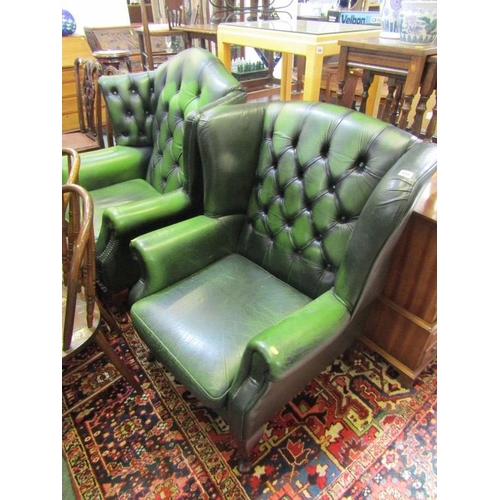 658 - LEATHER EFFECT BUTTON BACK WING ARM CHAIRS, on cabriole legs, larger 33