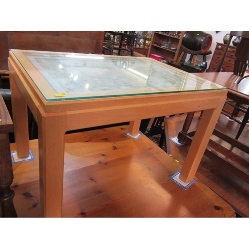 638 - BEECH FRAMED COFFEE TABLE, rectangular form with a needlework decorated top, under plate glass. 28