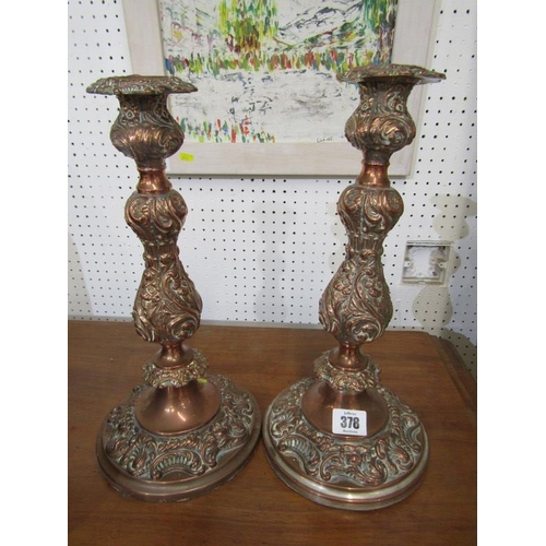 378 - SHEFFIELD PLATE CANDLESTICKS, pair of circular based richly embossed 13