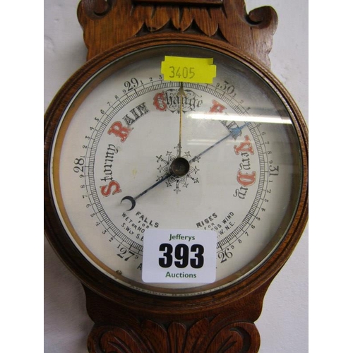 393 - ANEROID BAROMETER, Edwardian carved oak barometer