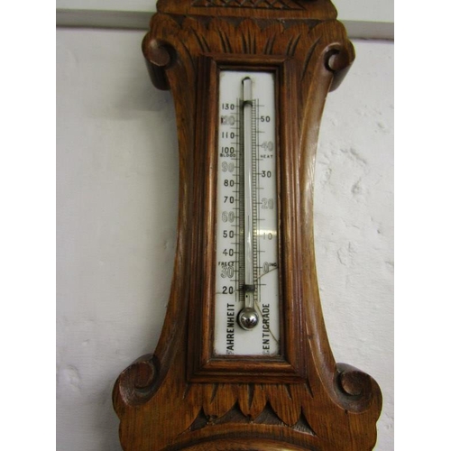 393 - ANEROID BAROMETER, Edwardian carved oak barometer