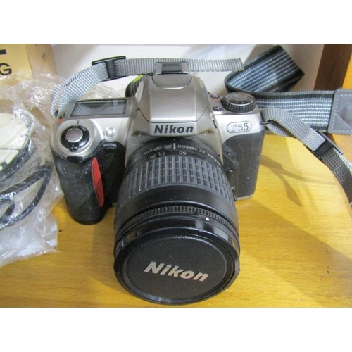 44 - PHOTOGRAPHY, Nikon F65 camera with telescopic lense and accessories