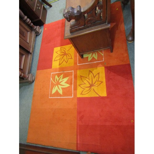 509 - RUG, orange and red rug with a geometric foliate pattern, 75