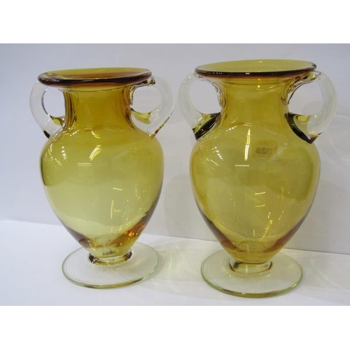 523 - ART GLASS, A pair of amber and clear glass twin handled 9