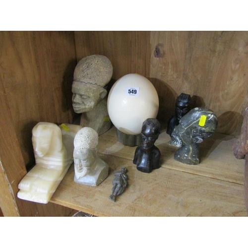 549 - ETHNIC CARVINGS, 5 Ethnic carved head sculptures also onyx carved sphinx ostrich egg & Roman style s... 