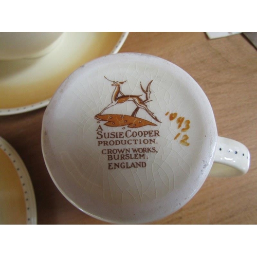606 - SUZIE COOPER, Brown rim tea ware, 5 cups, 6 saucers, 6 tea plates, cream jug, bowl and bread plate