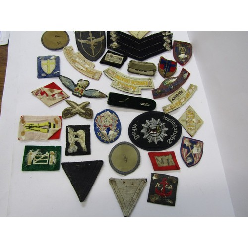 160 - MILITARY, A collection of embroidered cloth military badges including several with Nazi emblems