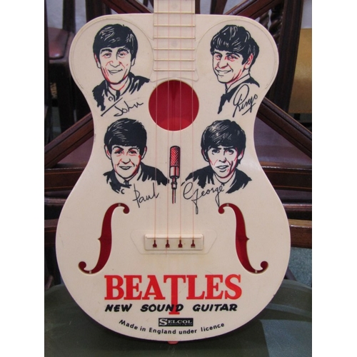 150 - THE BEATLES, a Selcol Beatles New Sound Guitar, 23