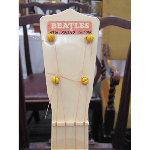 150 - THE BEATLES, a Selcol Beatles New Sound Guitar, 23