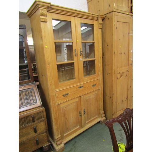 650 - PINE DOUBLE BOOKCASE, waxed pine double cupboard base glazed bookcase, ornate escutcheons, 78