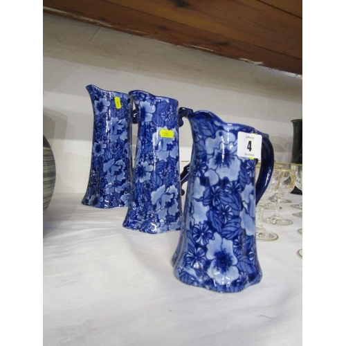 4 - TRANSFERWARE, set of 3 graduated blue design jugs