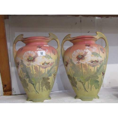 12 - ART NOUVEAU DESIGN, pair of poppy decorated twin handled Continental pottery vases, 32cm height