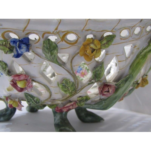 24 - ANTIQUE CONTINENTAL FAIENCE, floral encrusted pierced diamond shaped fruit bowl, 31cm width