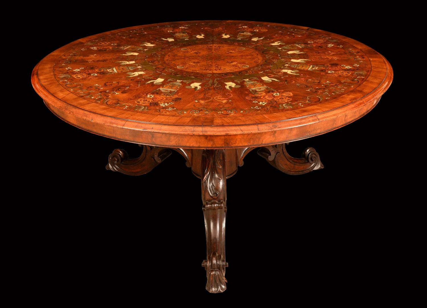 A fine Victorian mahogany and marquetry circular centre table, the well...