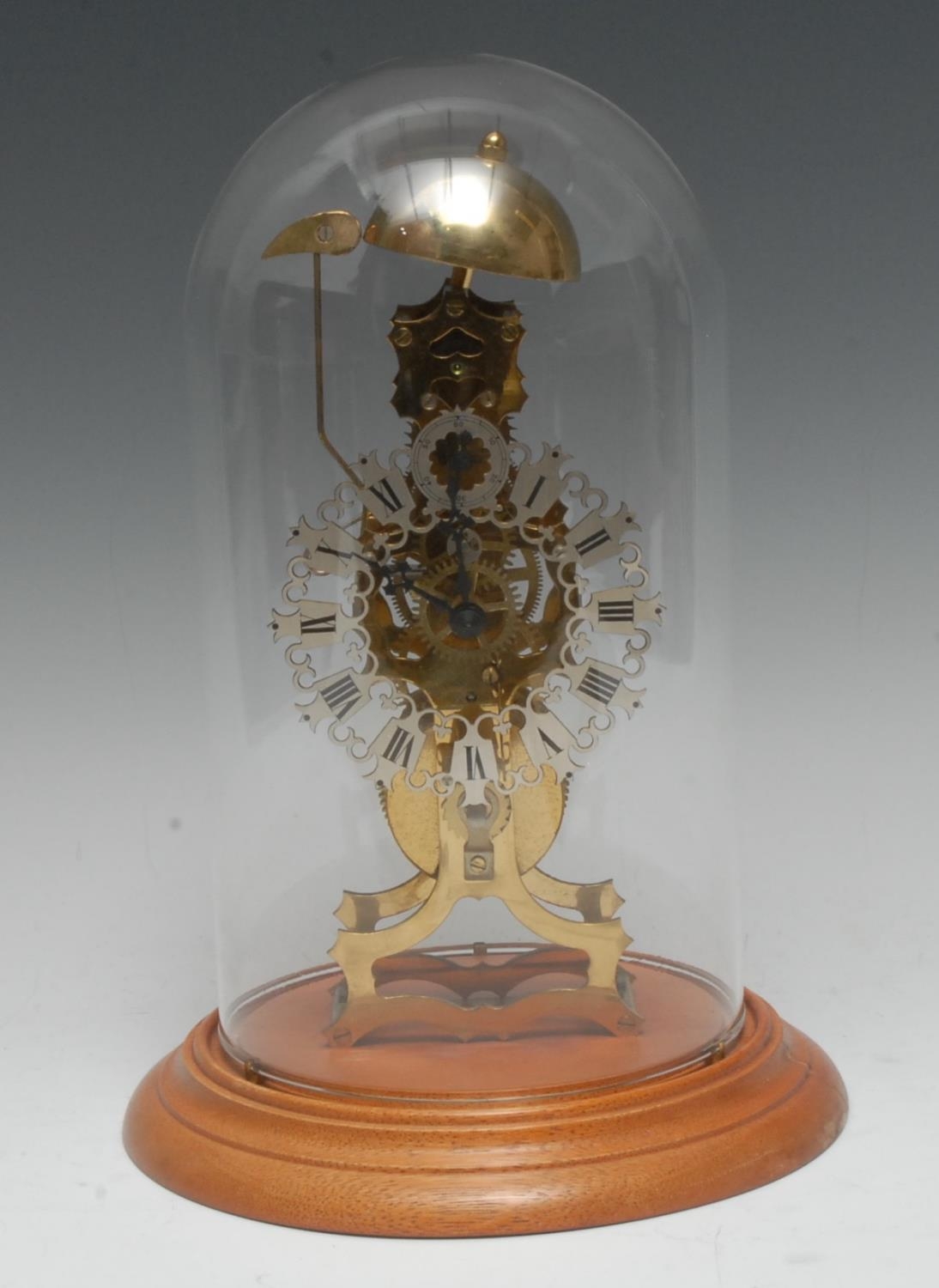 A Gothic Revival style brass skeleton clock, 10cm silvered chapter ring...
