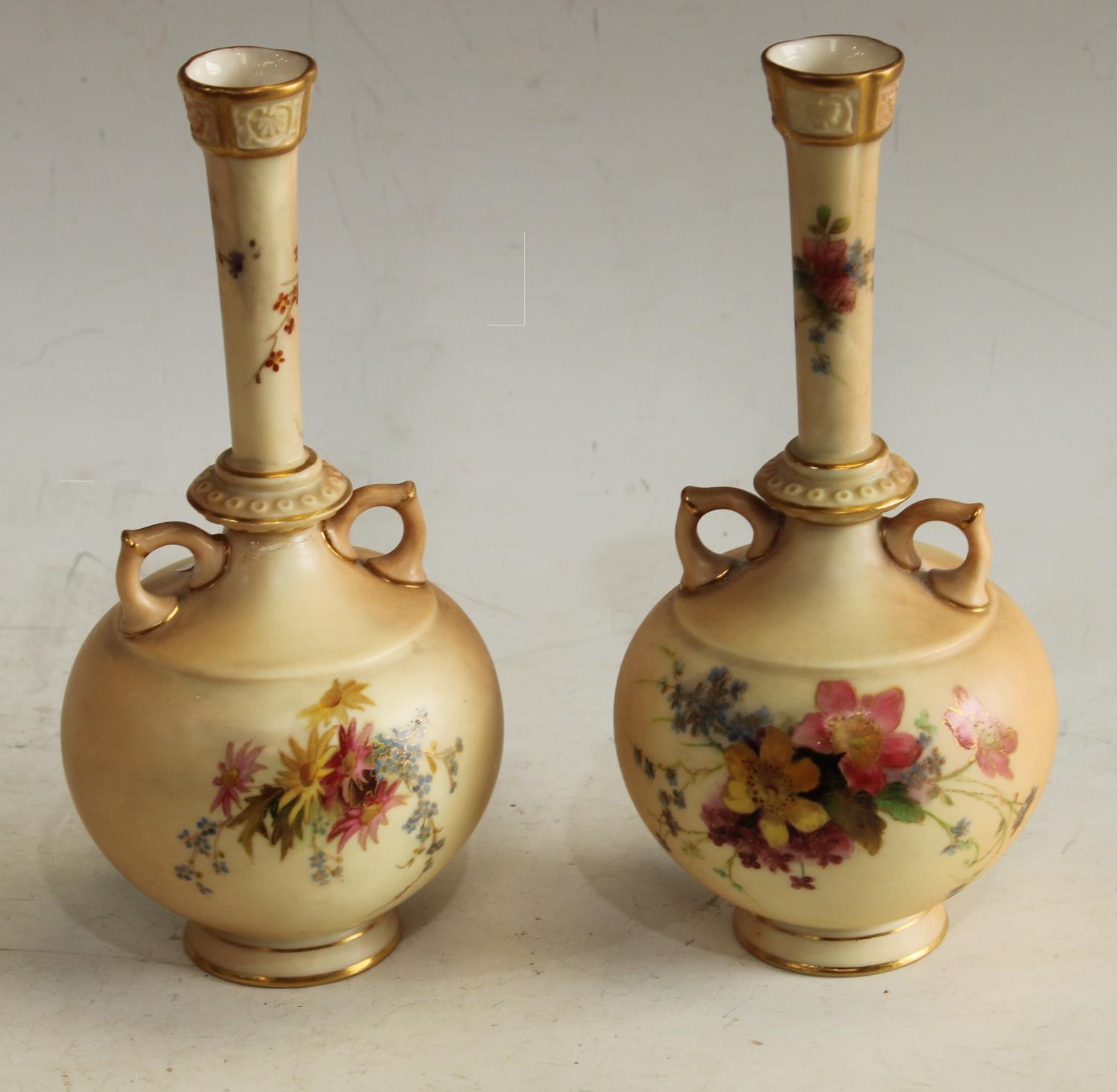 A pair of Royal Worcester Blush Ivory two handled vases