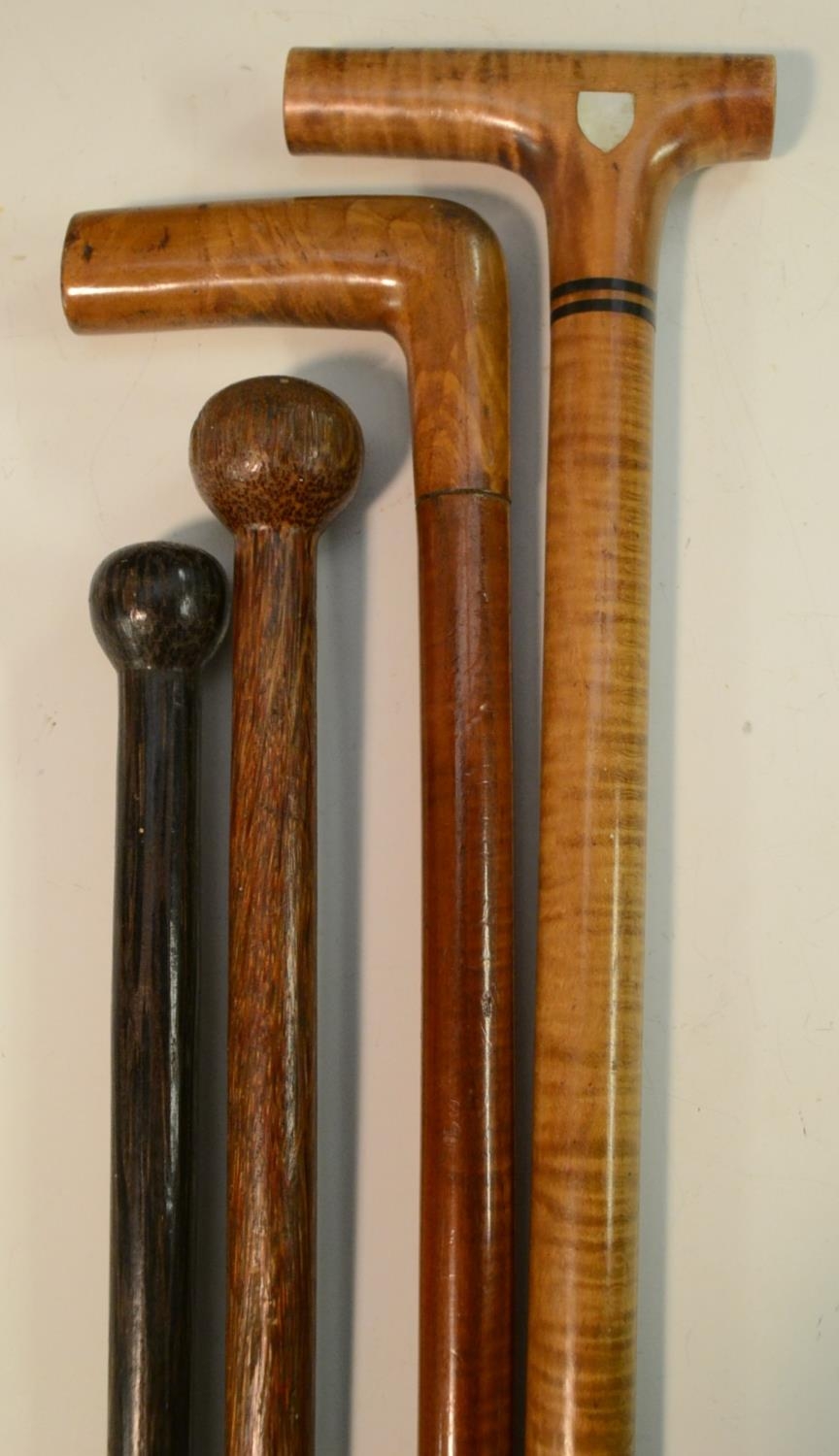 An early 20th century snakewood gentleman's walking cane, the L-shaped ...