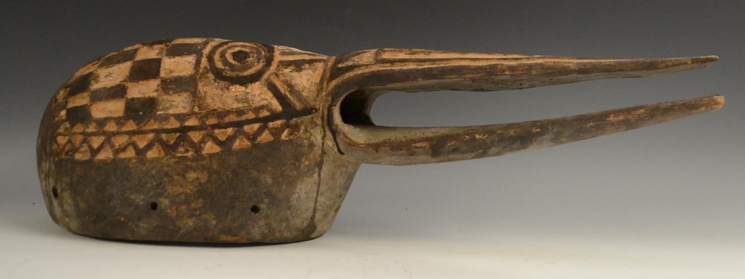 Tribal Art - a Mossi bird mask, carved with stylised features and geometric...